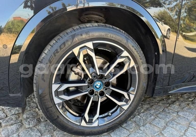 Big with watermark bmw ix bagmati behind berlin 34320