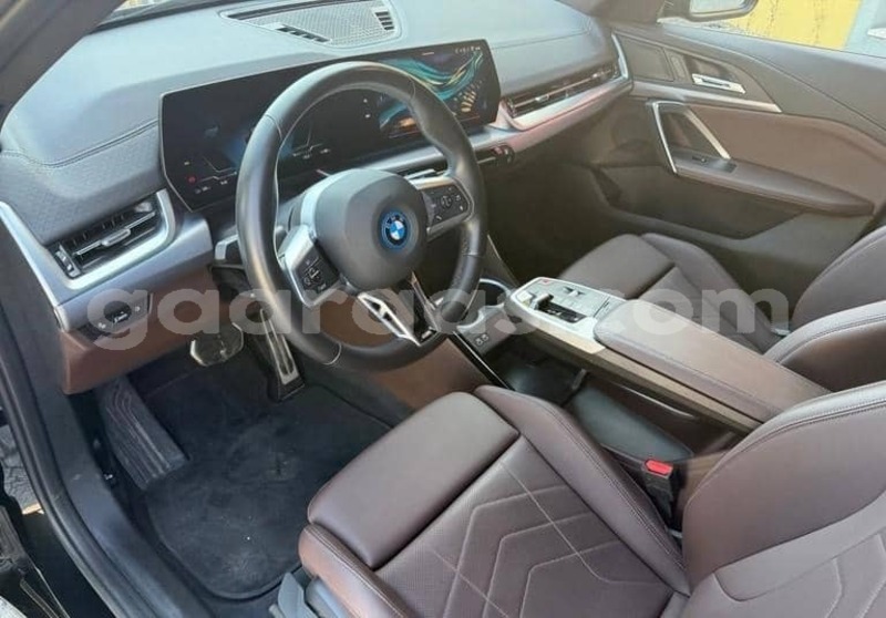 Big with watermark bmw ix bagmati behind berlin 34320