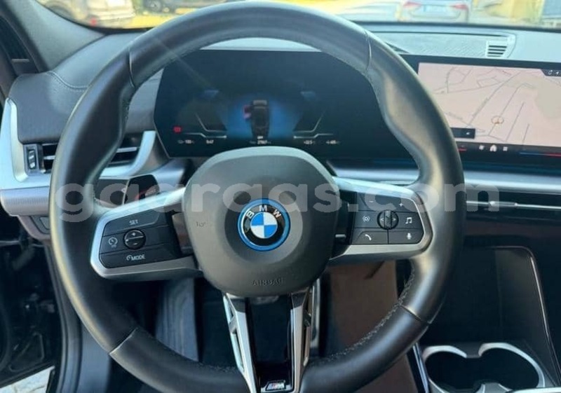 Big with watermark bmw ix bagmati behind berlin 34320