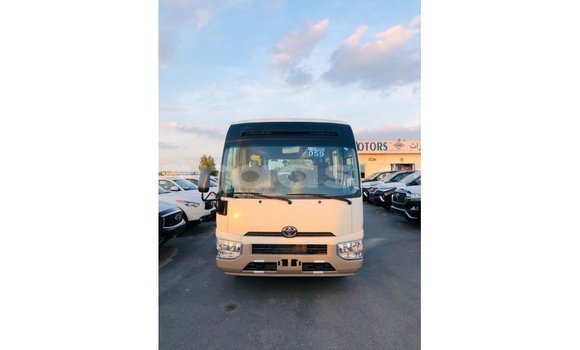 Acheter Import Voiture Toyota Coaster Blanc à Import - Dubai, Dakar